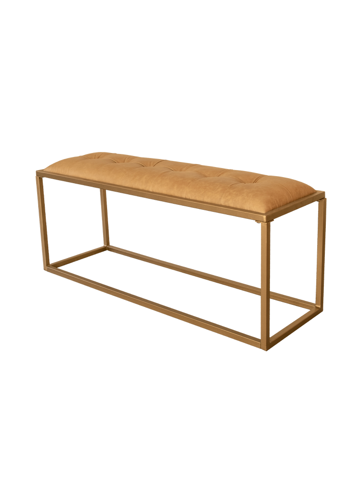 An upholstered bench with a golden finished iron frame and padded top covered in brown genuine leather.