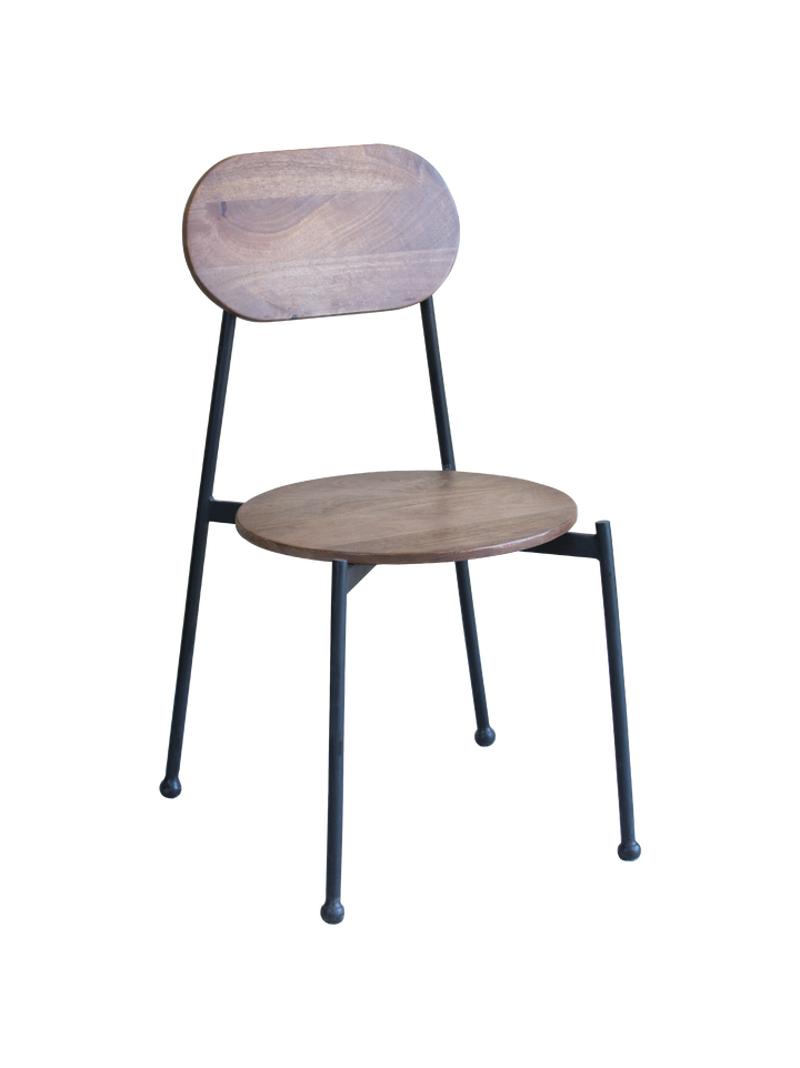 A set of two Mia dining chairs with solid mango wood seats and iron frames.