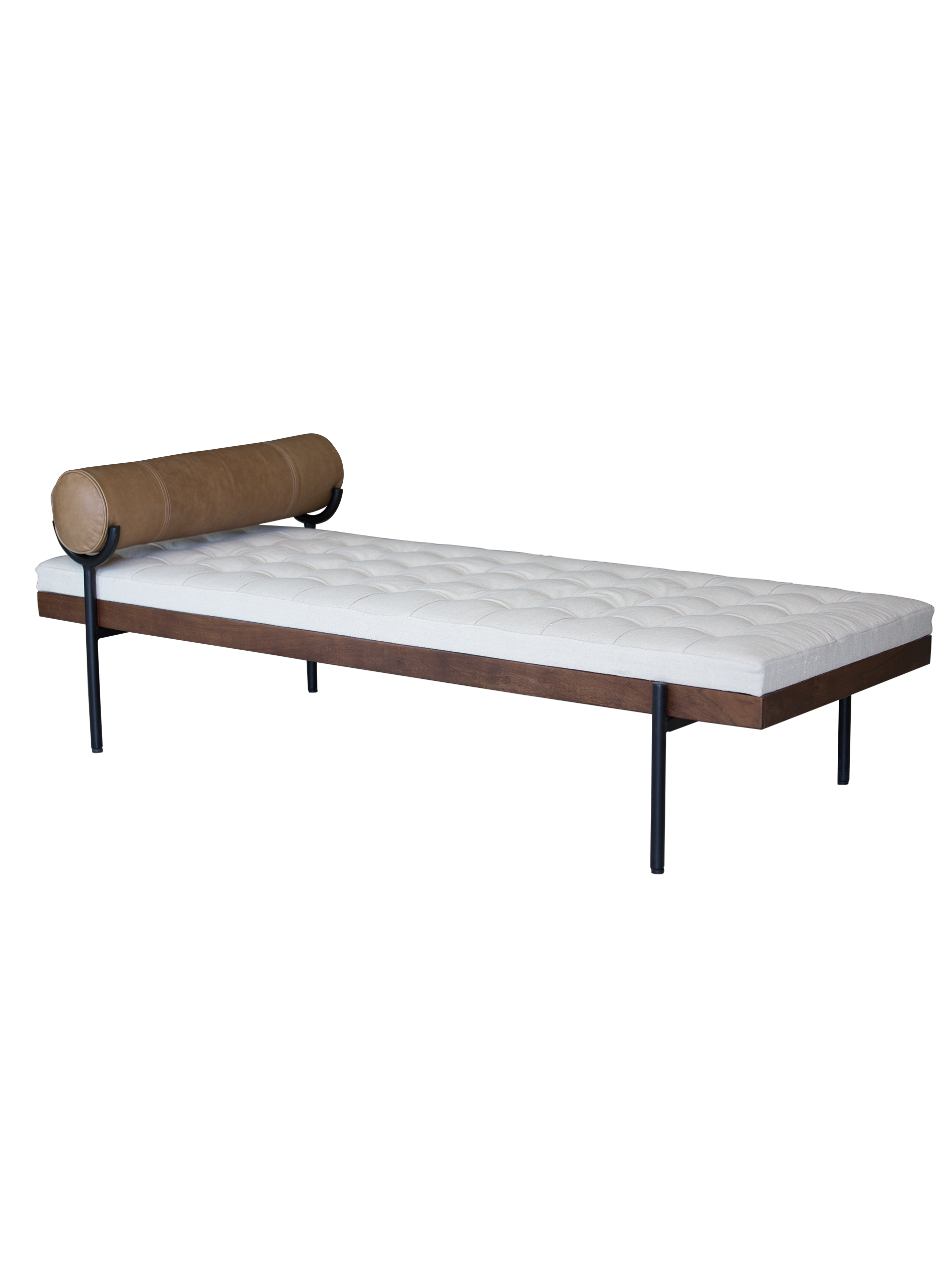 A day bed with a white cushion and brown leather pillow on a black iron frame.