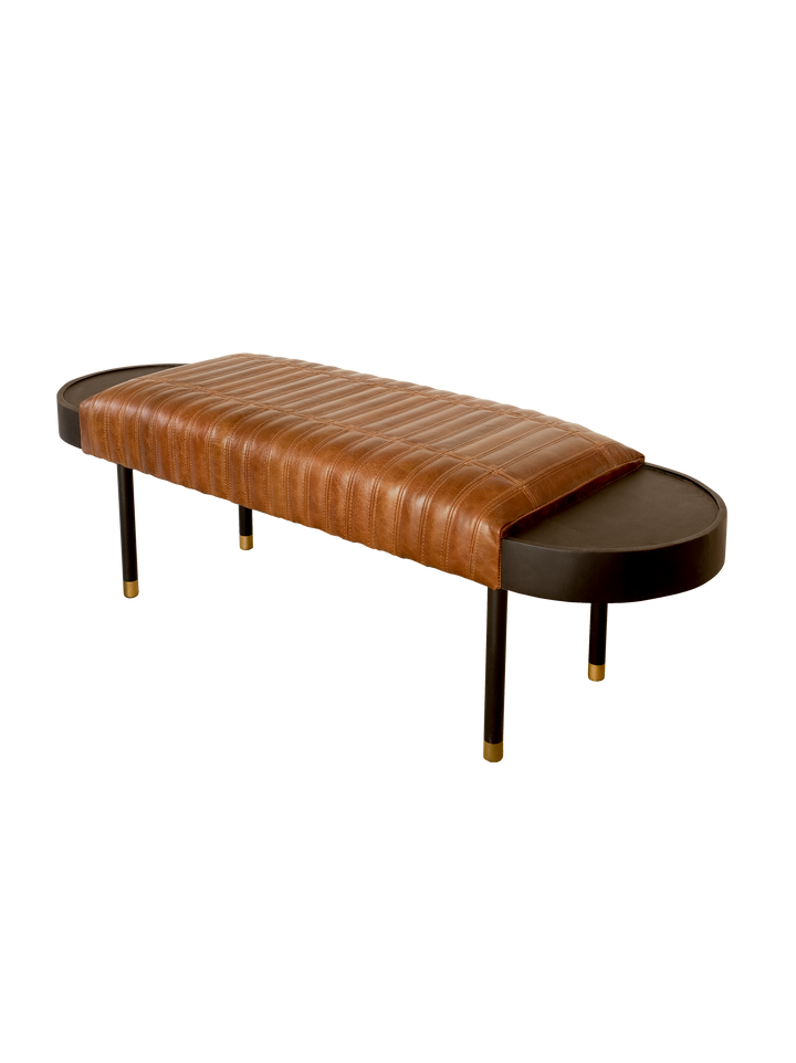 A brown upholstered bench with genuine leather padding and mango wood legs, finished with gold accents on the legs.